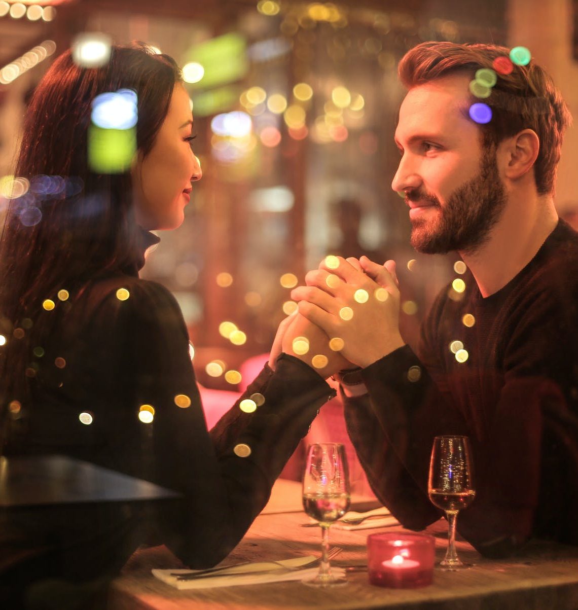 photography of couple holding hands